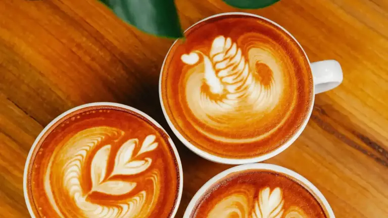 Three cups of latte art