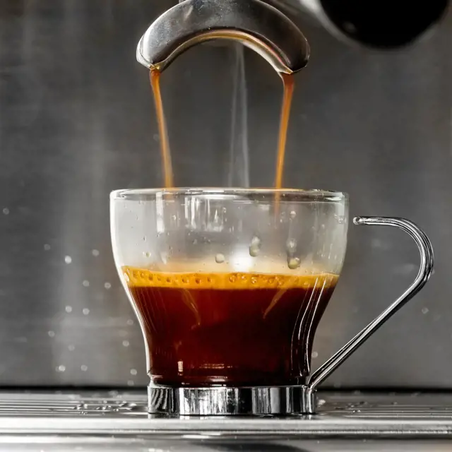 Coffee pouring out of a double sprout espresso machine