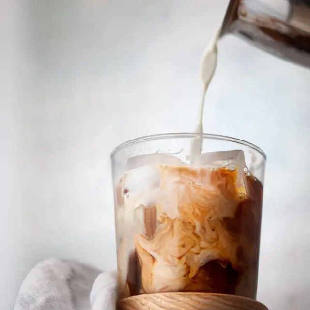 Pour The Milk Over The Vanilla And Ice Cubes For Your Vanilla Iced Coffee