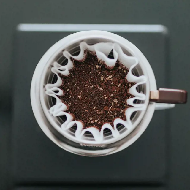 add your grounded coffee in the paper coffee filter